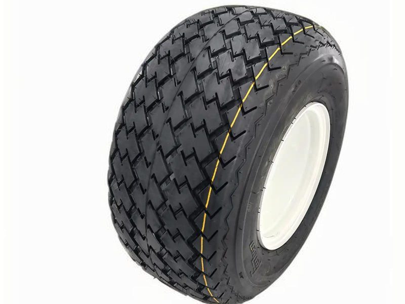 Close-up of golf cart tires on grass